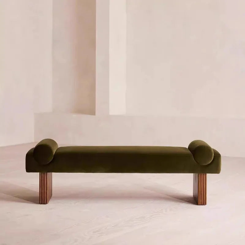 Green bench with curved ends on a plain background