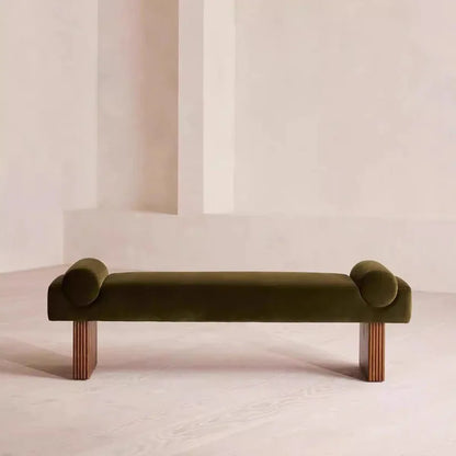 Green bench with curved ends on a plain background