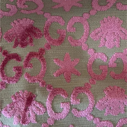 Pink floral and leaf pattern on a green background