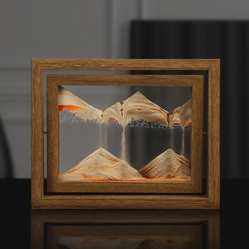 Wooden-framed artwork of mountains with a blurred background