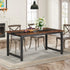 Close-up of wood-grain-style tabletop on a modern desk.