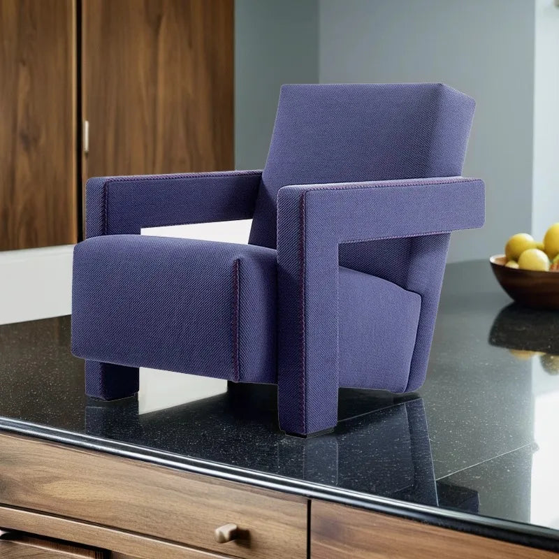 Purple armchair on a reflective surface with a blurred background