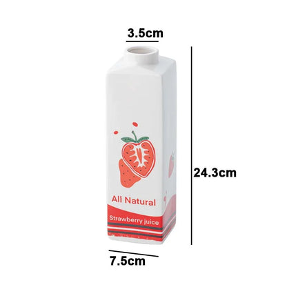 Carton of strawberry juice with dimensions labeled on a white background