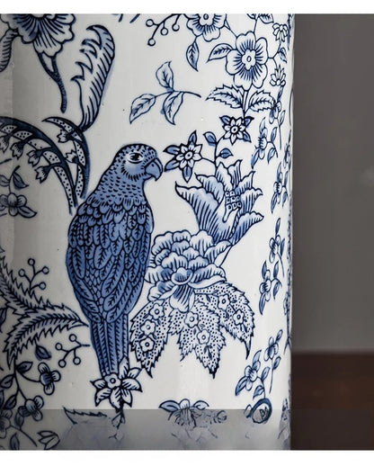 Blue parrot and floral design on a white background
