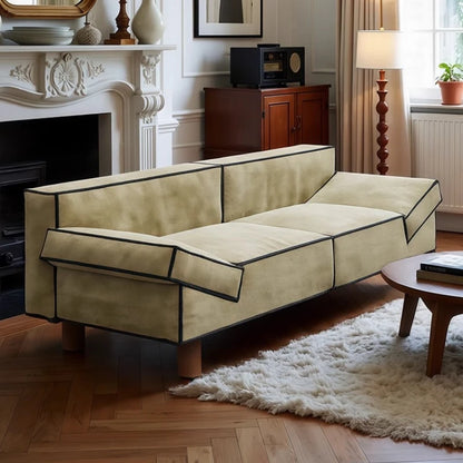 Beige sofa in a living room with a fireplace and wooden coffee table.