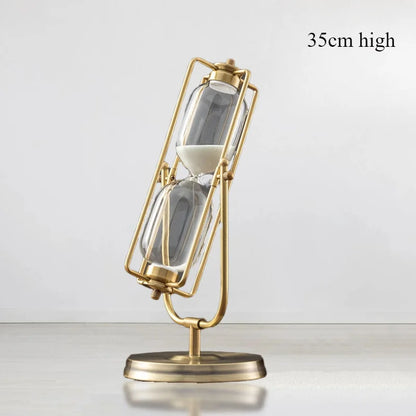 Gold hourglass sand timer on a white background with &