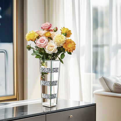 Decorative vase with flowers on a table in a room with curtains and a mirror.
