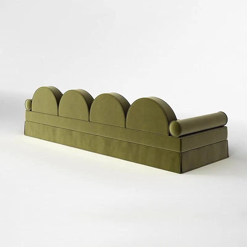 Green decorative item with curved design on a white background