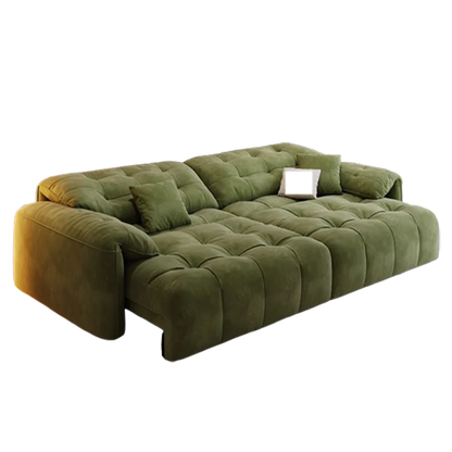 Green sofa with tufted design on a white background