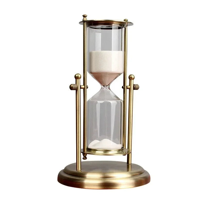 Gold hourglass with sand on a white background