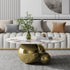 "Round metal coffee table with Moroccan-inspired design for living rooms"