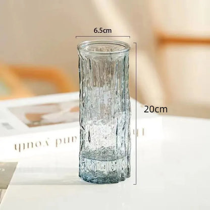 Clear glass vase with dimensions on a blurred background