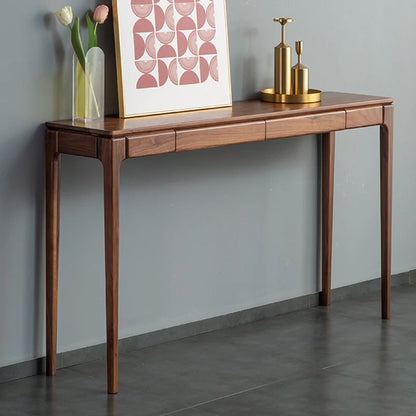 Wooden console table against a gray wall with decorative items on top
