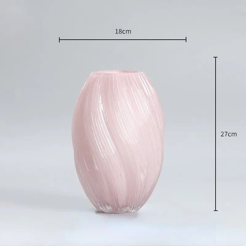Pink ribbed vase with dimensions on a gray background