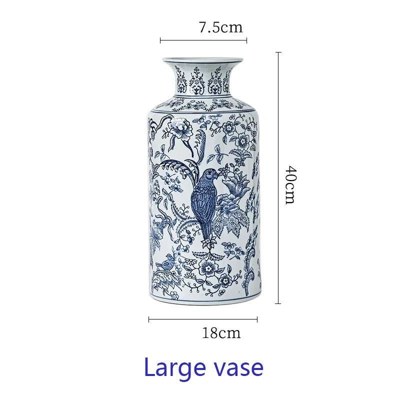 Blue and white decorative vase with floral and bird patterns, shown with measurements on a white background.