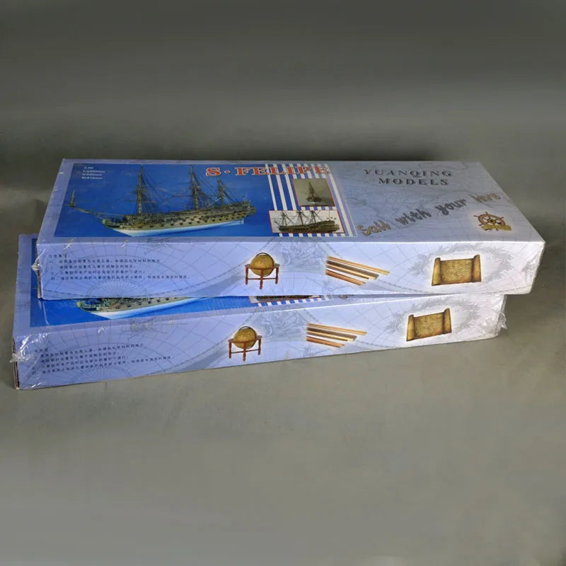 Model ship kit packaging on a gray background