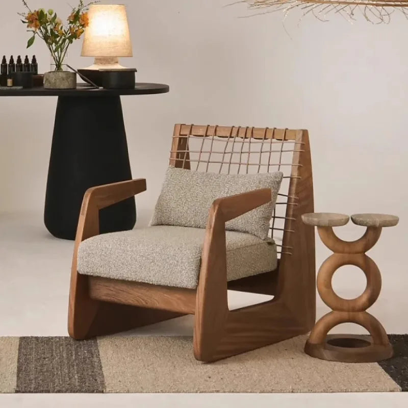 Wooden armchair with woven backrest in a modern interior setting