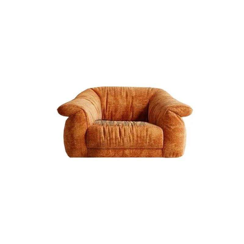 Orange armchair on a white background
