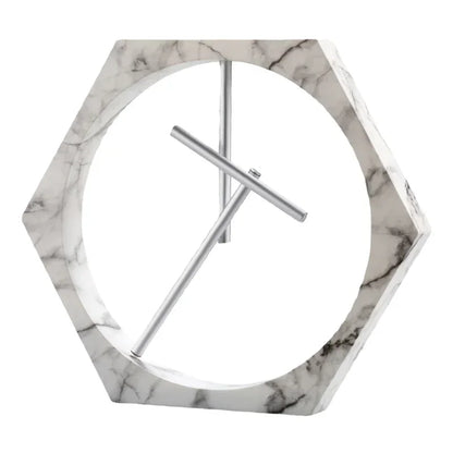 Hexagonal marble clock with silver hands on a white background