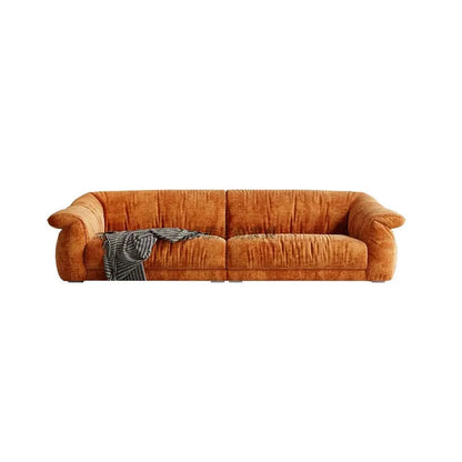 Brown sofa with a blanket on a white background
