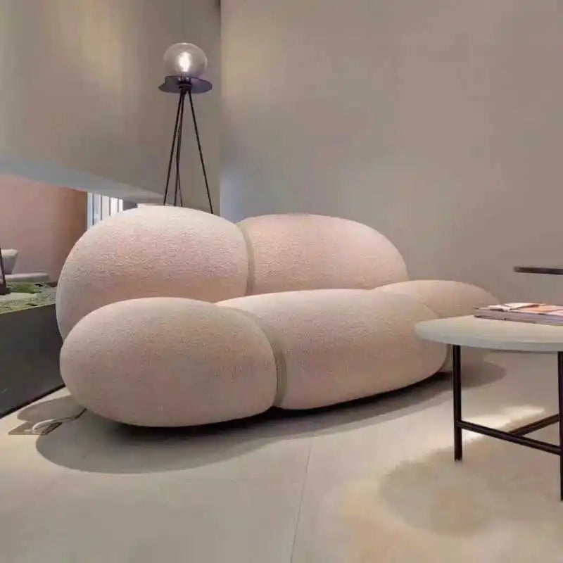 Modern white sofa in a minimalistic living room setting