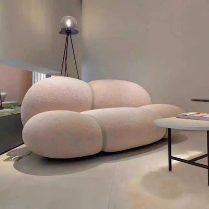 Modern white sofa in a minimalistic living room setting