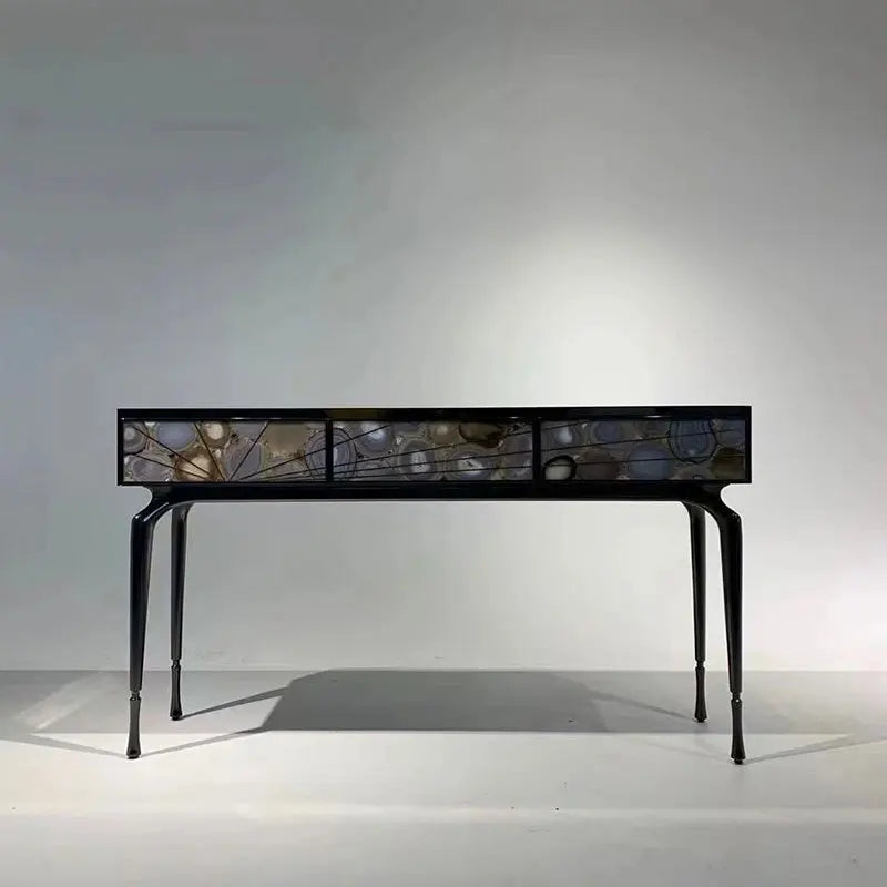 Decorative console table with glass panels on a white background