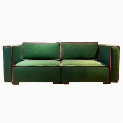 Green sofa with red trim on a white background