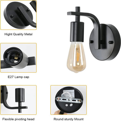 Black wall-mounted light fixture with detailed features on a white background