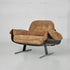 Brown armchair with a metal base on a white background