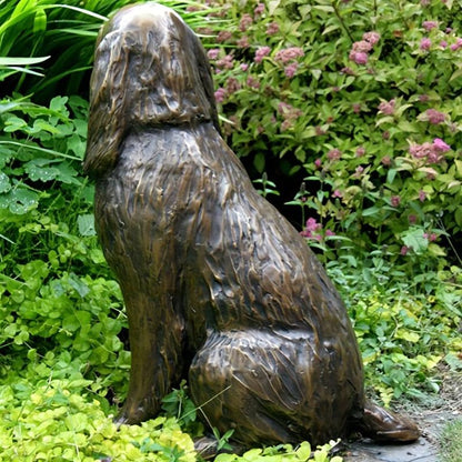 Cold cast bronze statue of a sitting Cocker Spaniel.