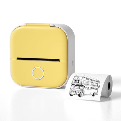 Yellow portable printer with a roll of paper featuring a black and white illustration of a London bus on a white background