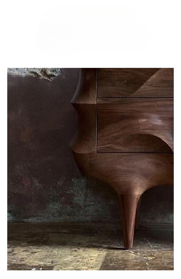 Wooden sideboard with wavy design against a textured wall