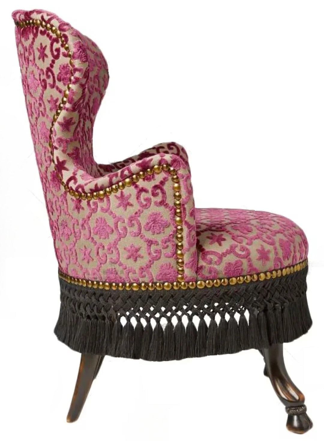 Decorative armchair with pink floral pattern and gold accents on a white background