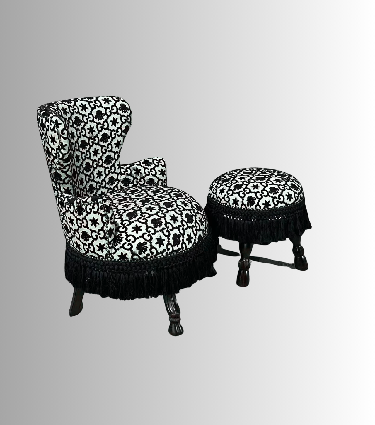 Decorative chair and ottoman with black and white pattern on a gray background