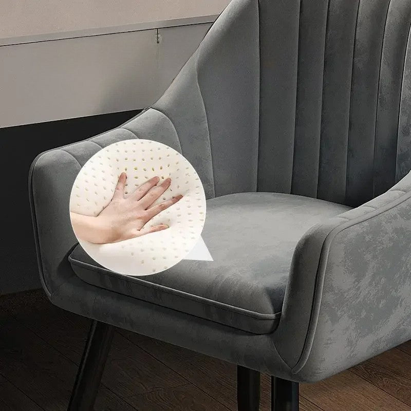 Gray chair with a white seat cushion on a wooden floor.